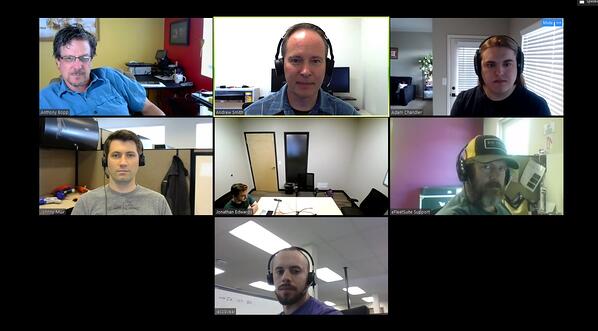 Zoom grid with one participant in a meeting room